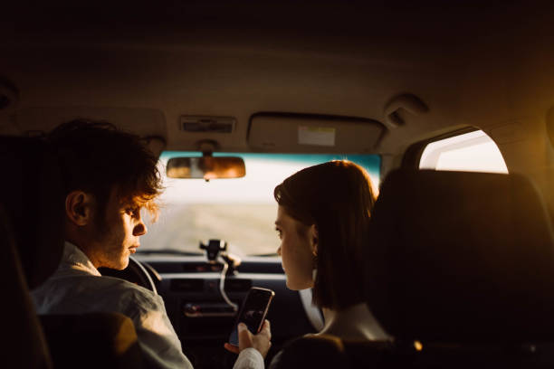 istock young couple in a car on a summer trip 2157694375