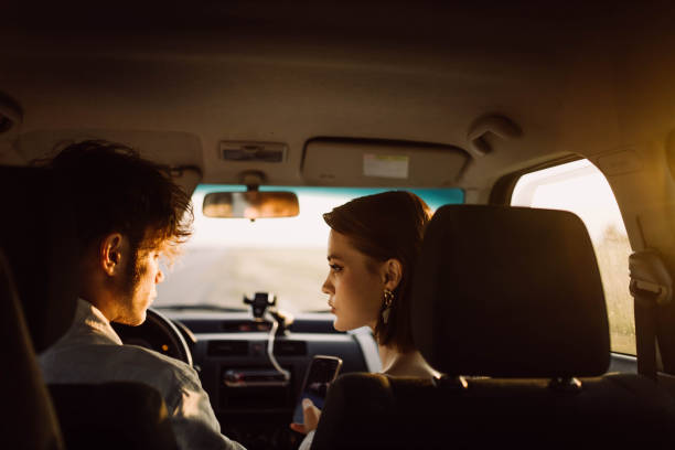 istock young couple in a car on a summer trip 2157694458