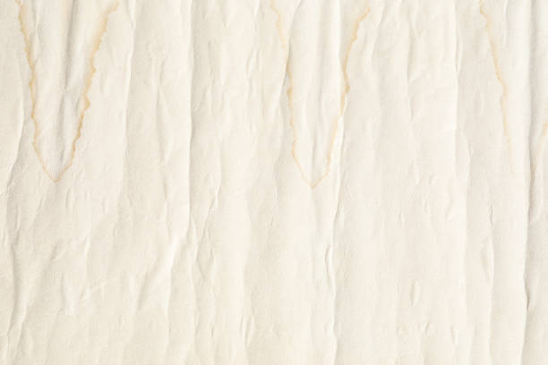 Crumpled yellow background paper texture with lines