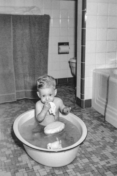 Adorable Happy Asian Boy Having Fun While Taking Long Bath In Bathtub