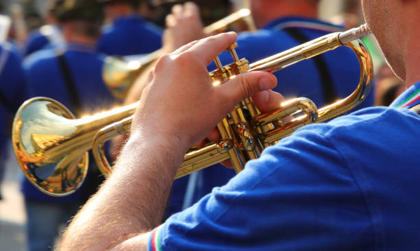 istock Brass trumpet player marching with the band during the parade 2157702407