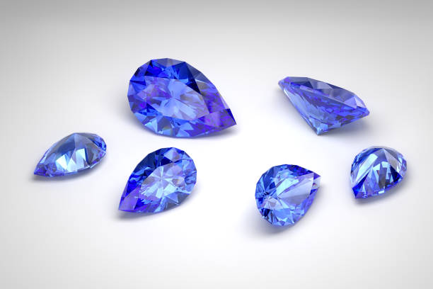 Scattering of blue sapphires of different sizes on a white background. Exhibition of precious stones. Pear cut. 3d rendering.