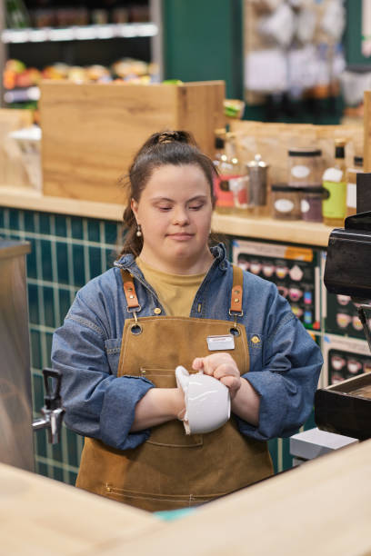 istock Girl with Disability Working in Cafe Enjoying Occupational Training 2157706024