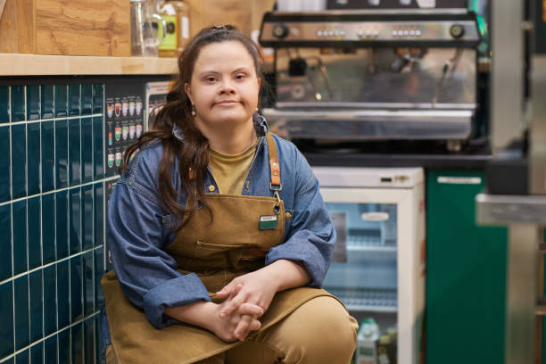 istock Independent Woman with Down Syndrome Working in Cafe 2157706030