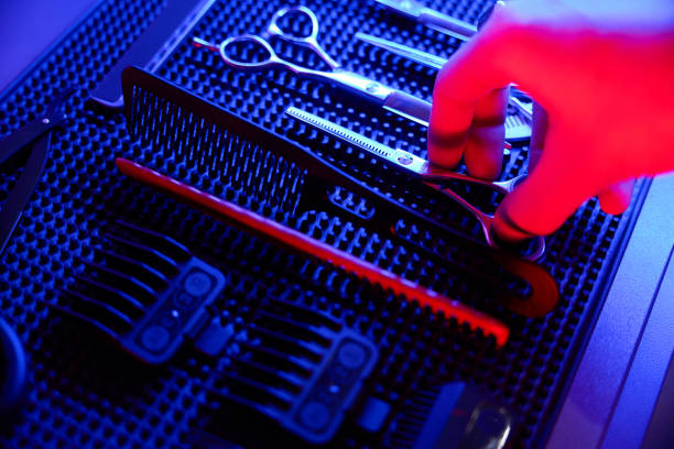 Barber collection of hair styling tools spectacularly illuminated in high end salon