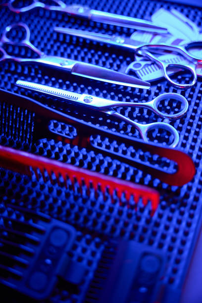 Barber collection of hair styling tools spectacularly illuminated in high end salon