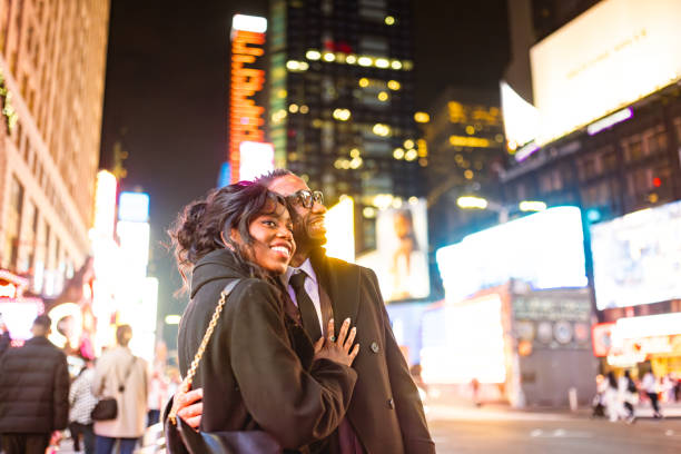 istock Elegantly Dressed Couple Enjoy Night at Times Square 2157708013