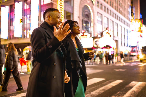 istock Elegantly Dressed Couple in Times Square at Night 2157708049