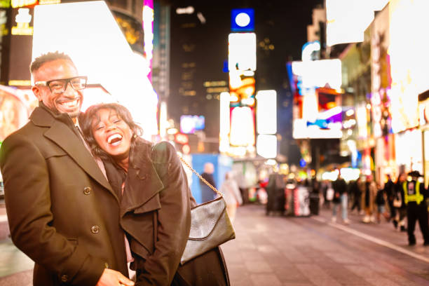 istock Elegantly Dressed Couple in Times Square at Night 2157708109