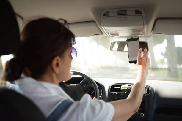 istock Female driver using a GPS on the smart phone 2157708231
