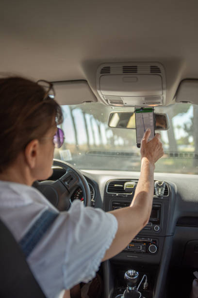 istock Female driver using a GPS on the smart phone 2157708247