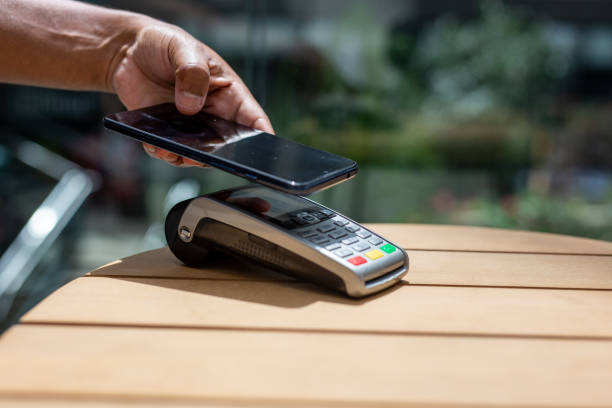 istock person mobile phone payment terminal. 2157708732