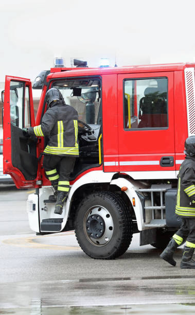 Firefighter swiftly disembarks from the fire truck during an emergency