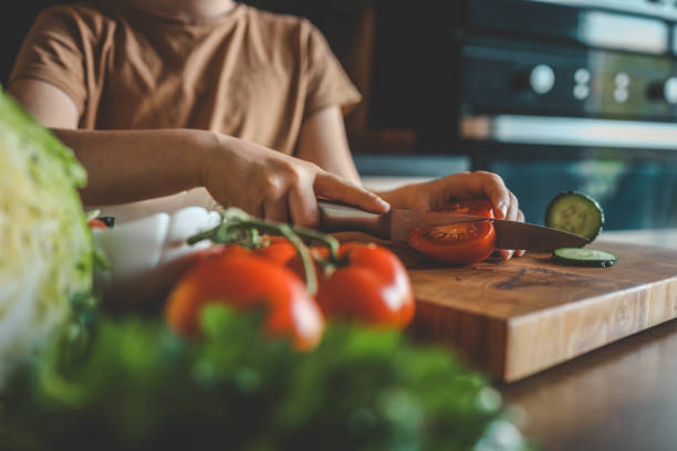 istock Child at table with leaf vegetables, a natural food ingredient 2157709685