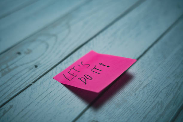 istock A sticker with the inscription Let's do it 2157709894