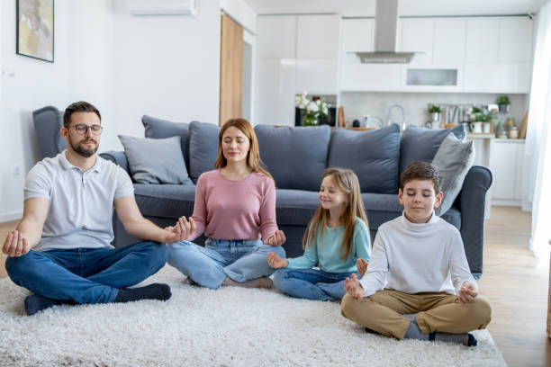 istock Family seated together in meditation pose 2157710970