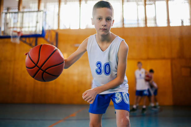istock Young athlete dribbling basketball 2157711329