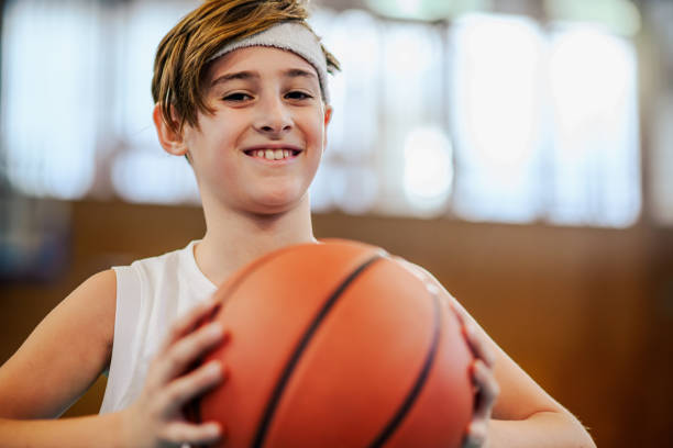 istock Happy kid with basketball in hands 2157711344