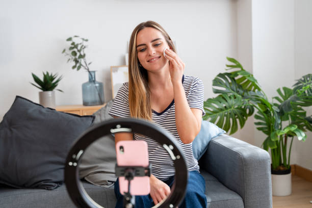 istock Beauty influencer removing makeup while recording video for her blog 2157713083