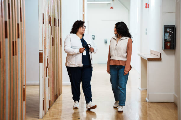 istock Latina doctor speaking with her patient 2157713432