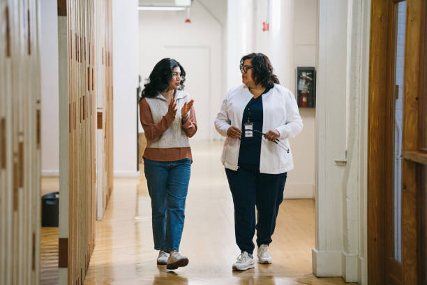 istock Latina doctor speaking with her patient 2157713436