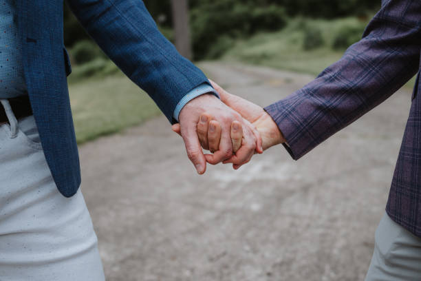 istock Betrothed gay couple holding hands 2157713593