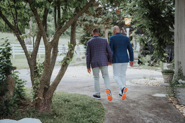 istock Gay couple holding hands after wedding ceremony 2157713650