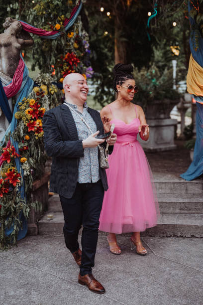istock Wedding guests laughing while attending outdoor reception 2157713681