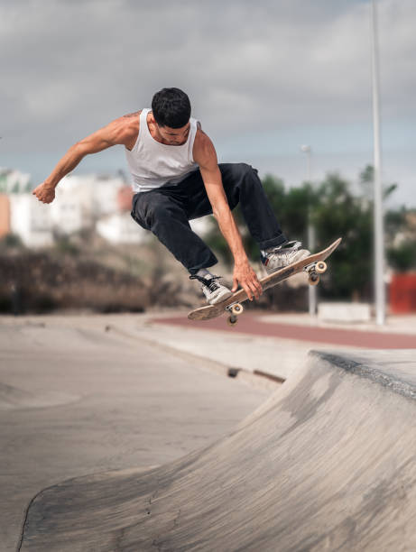 istock young man skates in a skate park in a cloudy day 2157714270