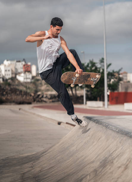 istock young man skates in a skate park in a cloudy day 2157714283