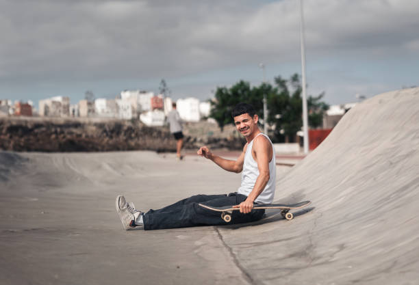 istock young man skates in a skate park in a cloudy day 2157714287