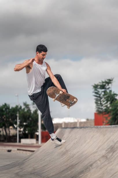 istock young man skates in a skate park in a cloudy day 2157714289