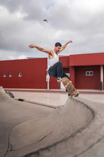 istock young man skates in a skate park in a cloudy day 2157714327