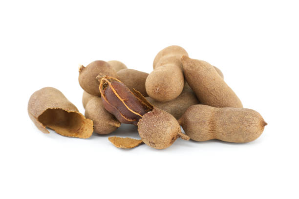 istock Tamarind whole and cracked open on white background 2157715625
