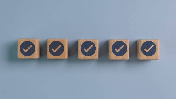 istock A row of wooden blocks with a blue check mark on them 2157715821
