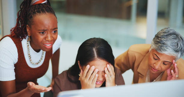 istock Business people, women and mistake with stress, computer and error with startup failure, 404 glitch and conflict. Group, coworkers and staff with pc, sad or emotion with anxiety, deadline or bad news 2157716295
