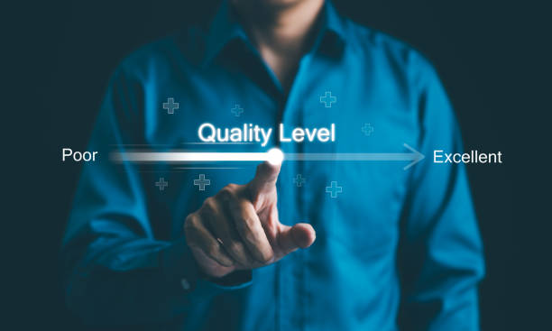 istock Concept of adjusting quality level from poor to excellent. A businessman adjusts a virtual quality level slider, symbolizing improvement from poor to excellent standards in business practices. QC QA, 2157716791