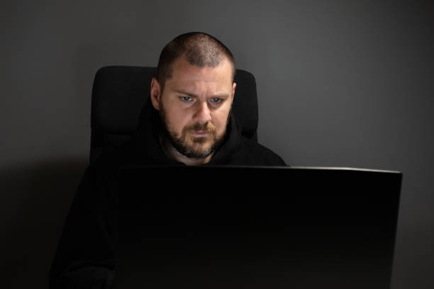 istock Hacker, man with laptop, cyber burglar, banking theft, security risk. 2157717241