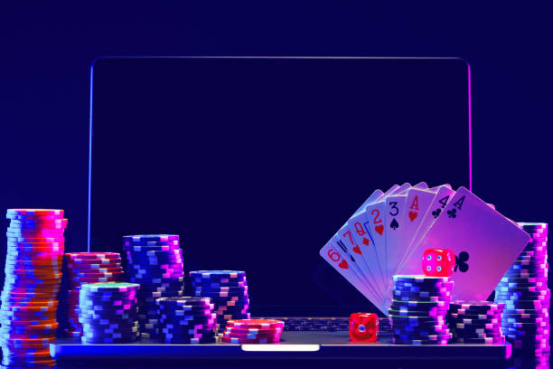 istock Laptop With Playing Cards and Poker Chips on a Green Table 2157717365