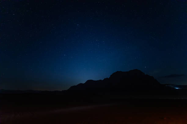 istock Starry night over jabal al qattar in Wadi Rum desert 2157717521