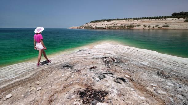 istock Young woman enjoying scenic coastal walk 2157717564