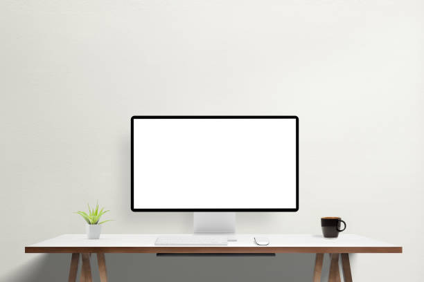 istock White screen on modern computer display on work desk. Mockup for agency web page or app presentation. Ideal for showcasing digital designs and professional portfolio 2157718446