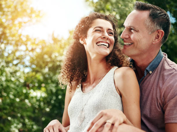 istock Smile, couple and hug for marriage with commitment, relationship and happiness on honeymoon. Excited, husband and wife with love embrace for connection, support and time together outdoor in nature 2157718504