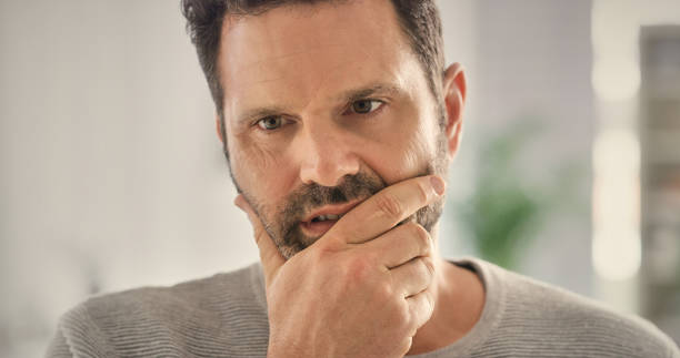 istock Home, doubt and man with stress, thinking and morning with worry, overwhelmed or concern. Apartment, reaction and person with anxiety, confused for mistake with mental health, fail and crisis 2157720617
