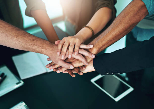 istock Hands, together and join us for teamwork collaboration in business, project or sign of commitment. People, meeting and team building a connection in office with community, communication or support 2157721952