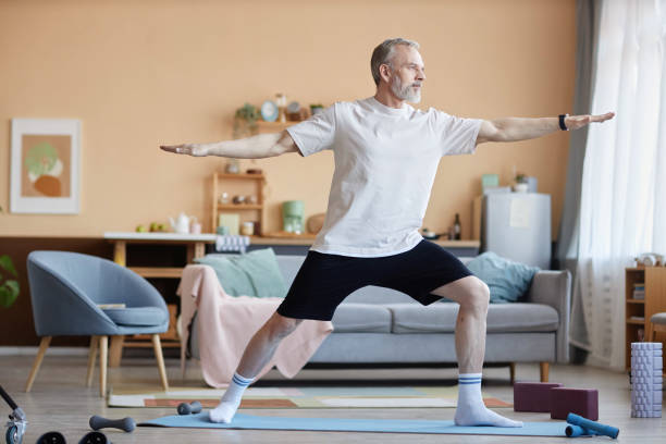 istock Senior Man Standing Yoga Pose 2157722213
