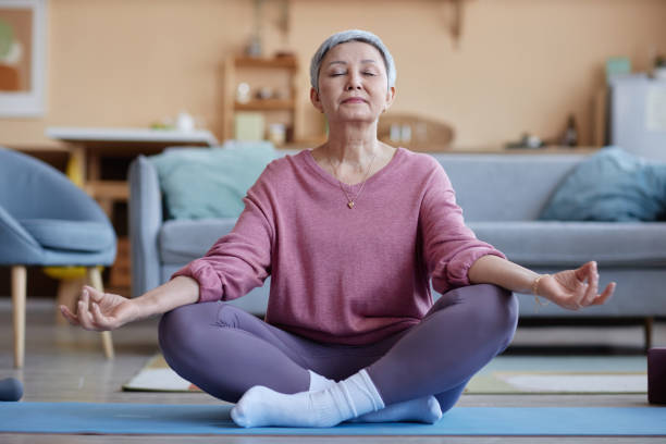 istock Senior Woman Meditating 2157722216