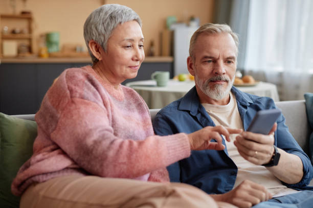 istock Senior Couple Using Phone Enjoying Online Shopping 2157722247