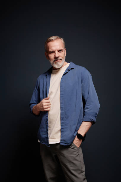 istock Portrait on Modern Senior Man on Black 2157722290