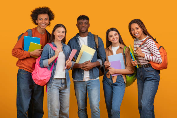 istock Student friends with books and backpacks smiling 2157722414